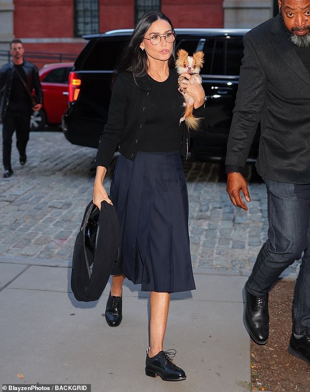 Demi Moore, 61, looked effortlessly stylish in an all-black, minimalist Thom Browne look as she left a screening of her new film The Substance on Monday