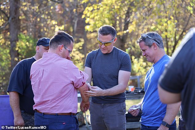 A reporter (left) was hit by a bullet fragment during a campaign event for Democrat Lucas Junce (center) with former Republican Rep. Adam Kinzinger (right)