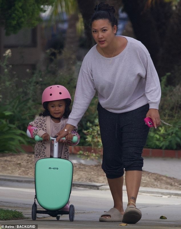 Sean 'Diddy' Combs' baby mama, Dana Tran, was spotted for the first time following the arrest of the rapper, 54, as she stepped out with their daughter wearing a 'Love' ring in Los Angeles on Saturday