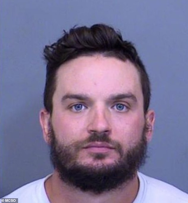 Jesse Michael Johnson, 28, was arrested Tuesday for hiding under women's cars to look at their feet