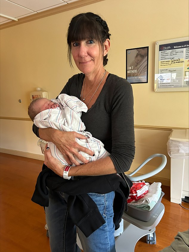 Tina Willits, now 53 years old and from Florida, was given just 24 months to live after she was diagnosed with stage four breast cancer. But the mother of five is still here, 31 months later, and cancer-free. She is pictured above with one of her grandchildren in her arms