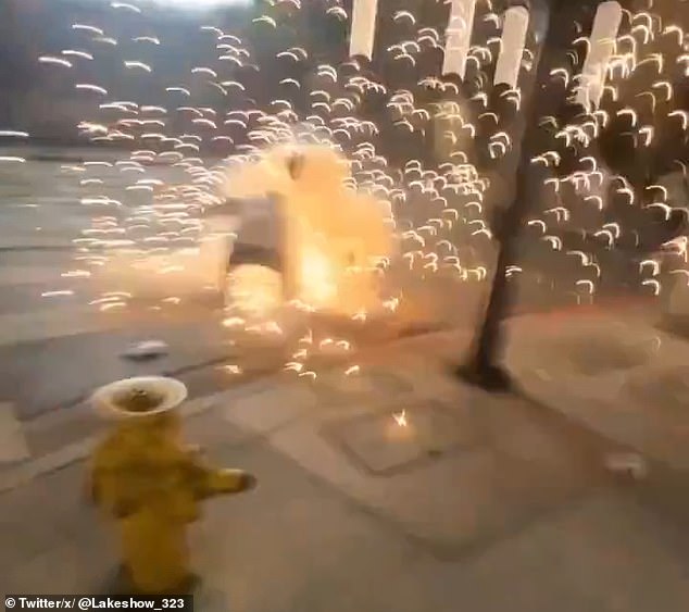 A Dodgers fan appears to shoot his fingers off while holding a firecracker