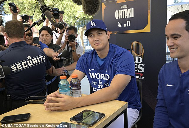 Design hitter Shohei Ohtani (17) of Los Angeles Dodgers answers questions on Thursday