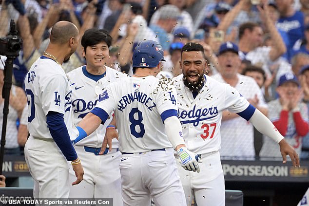 Enrique Hernandez (8) celebrates with shortstop Mookie Betts (50) and design hitter Shohei Ohtani (17) and outfielder Teoscar Hernandez (37) after hitting a solo home run