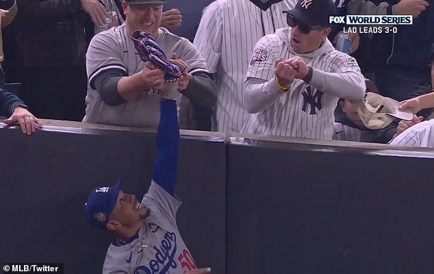 Dodgers star Mookie Betts had to fight off a fan who tried to wrestle the ball out of his glove