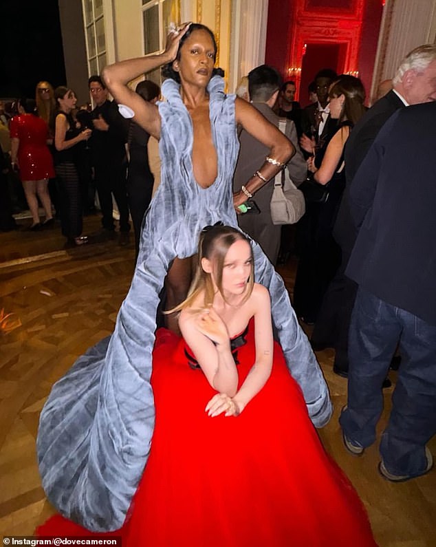 In one shot, Dove posed with model and photographer Richie Shazam at the Business of Fashion 500 Gala