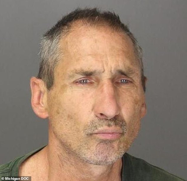 Russell Frank Valleau, 61, became enraged and tried to stab a black postal worker after receiving political mail for Vice President Kamala Harris' campaign (Farmington Hills Police Department)