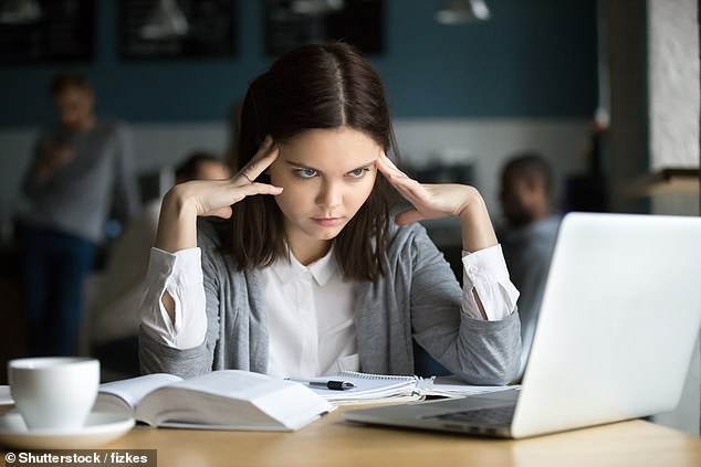 A woman has difficulty concentrating on her work. Professors at top universities have noticed that their students have difficulty reading and focusing (stock image)