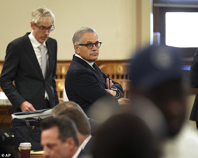 Philadelphia District Attorney Larry Krasner awaits the start of the hearing in the City Hall courtroom Thursday morning