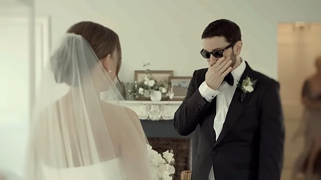 Eminem, 51, broke down in tears as he saw his daughter, Hailie Jade Scott, 28, in her wedding dress for the first time during an emotional moment in his music video for Temporary on Thursday