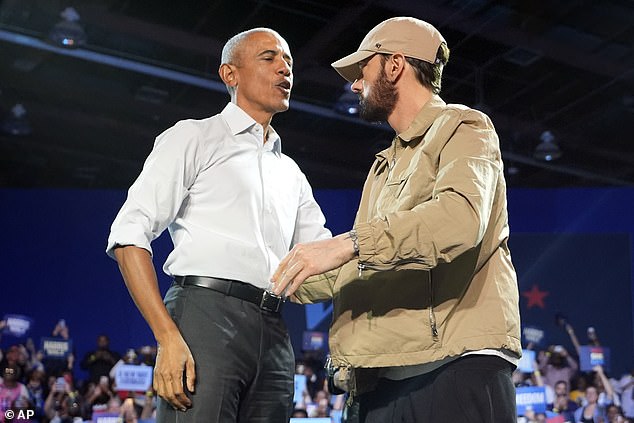 Stan hitmaker Eminem, 52, endorsed Democratic candidate Kamala Harris earlier this month - pictured at a campaign rally with former President Barack Obama