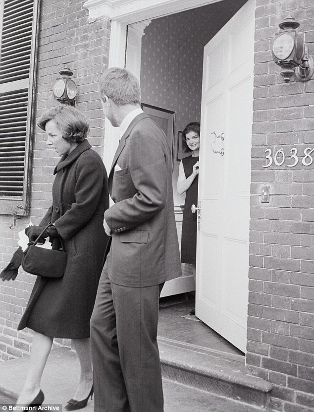 Jackie Kennedy exchanges a secret glance with brother-in-law Bobby behind his wife Ethel's back as they leave Jackie's Washington DC home in 1963, a month after JFK's assassination