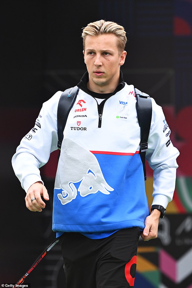 Liam Lawson (pictured after the Mexican Grand Prix) left fans divided as he appeared to stick his middle finger at Sergio Perez during an overtake