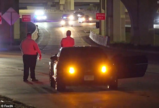 It is believed the car drove for some time before coming to a complete stop. Here you see police gathering around the 2013 muscle car