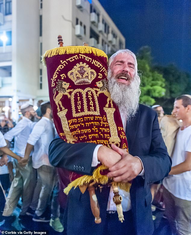 Jews celebrate Simchat Torah – one of the religion's most important holidays – in 2018