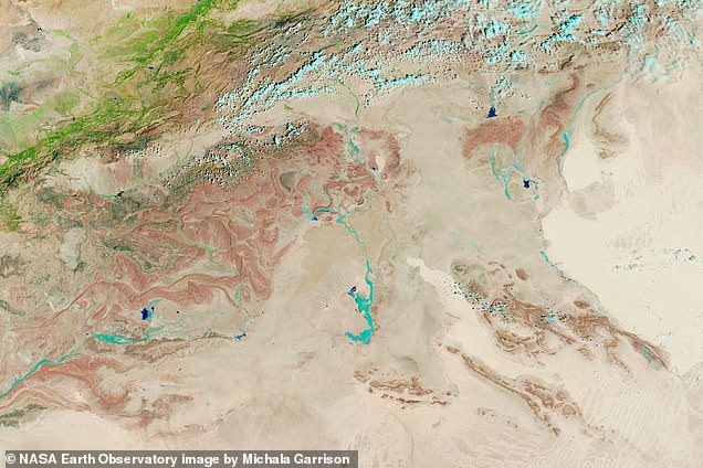 NASA satellite photo of the same area on September 10 shows runoff and floodwaters from an extratropical cyclone