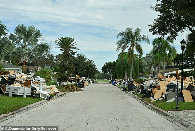 Damaged homes and debris litter the street of Tampa, Florida, Dana Shores neighborhood, October 8. There are fears of more destruction once Hurricane Milton hits