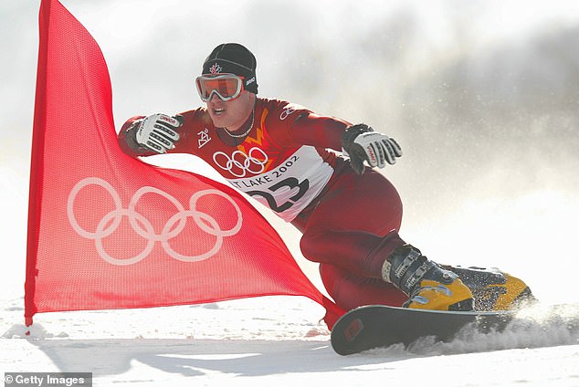 Ryan Wedding of Canada competes in the qualifying round of the men's parallel giant slalom snowboarding event at the Salt Lake City Winter Olympics at Park City Mountain Resort in Utah