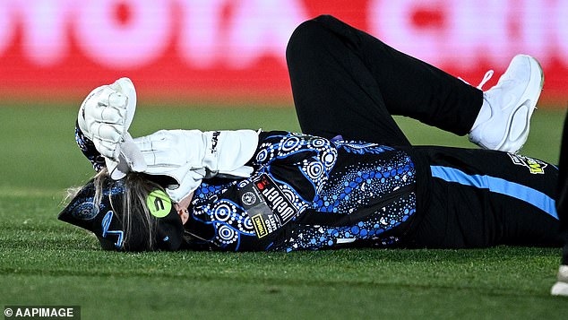 Bridget Patterson of the Adelaide Strikers reacts after being hit by a pitch from teammate Darcie Brown. Photo: Mark Metcalfe/Getty Images