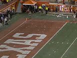 Furious Texas fans launch BOTTLES on field over controversial call vs Georgia - before decision is overturned