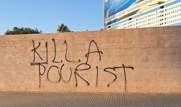 Protests against holidaymakers escalate into sinister twist as 'kill a tourist' graffiti appears on wall in Mallorca