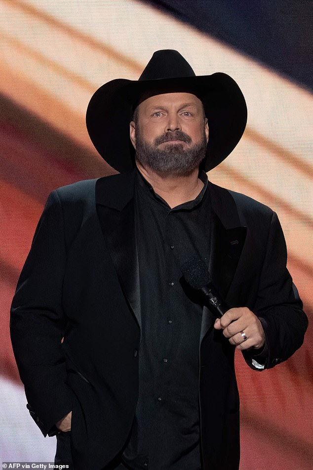 Garth Brooks, 62, has denied the rape allegations against him, calling it a 'hush money' shakedown; seen in 2023