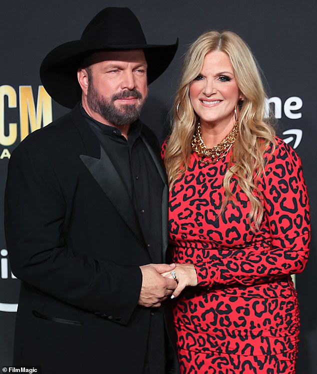 Garth Brooks, 62, has been sued by a makeup artist who worked for his wife of nearly two decades, Trisha Yearwood, 60; Brooks and Yearwood are pictured in 2023