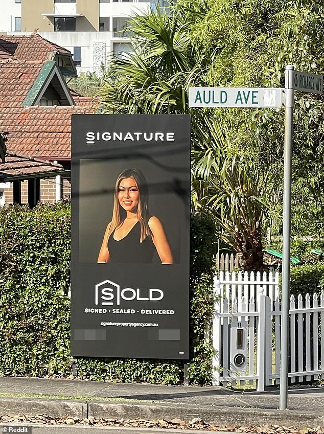 A glamorous estate agent has set tongues wagging after she decided to use her personal portrait on a big-sale sign instead of a photo of the property (pictured)