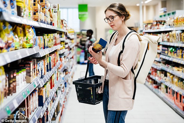 A woman examining a food label in a supermarket (stock image). Macrina Bakery's breads were marketed as 