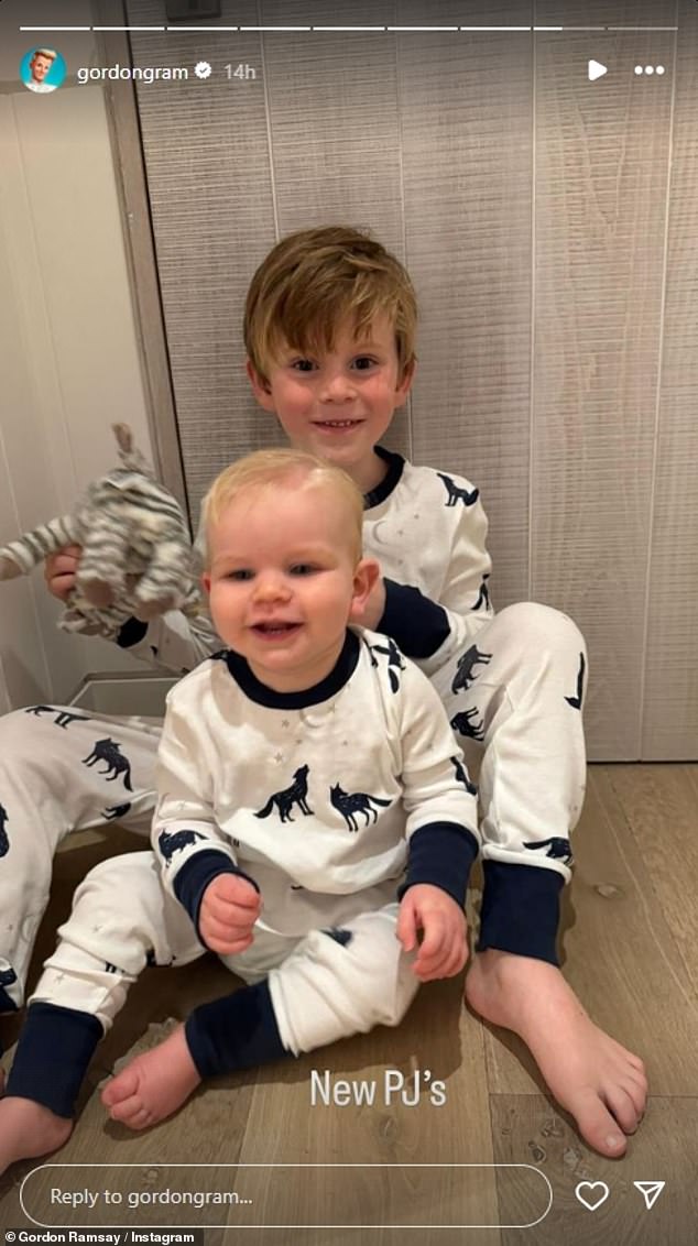 Later, the celebrity chef posted a photo of his two youngest boys in matching white wolf-print pajamas as they giggled while playing with a striped stuffed animal.