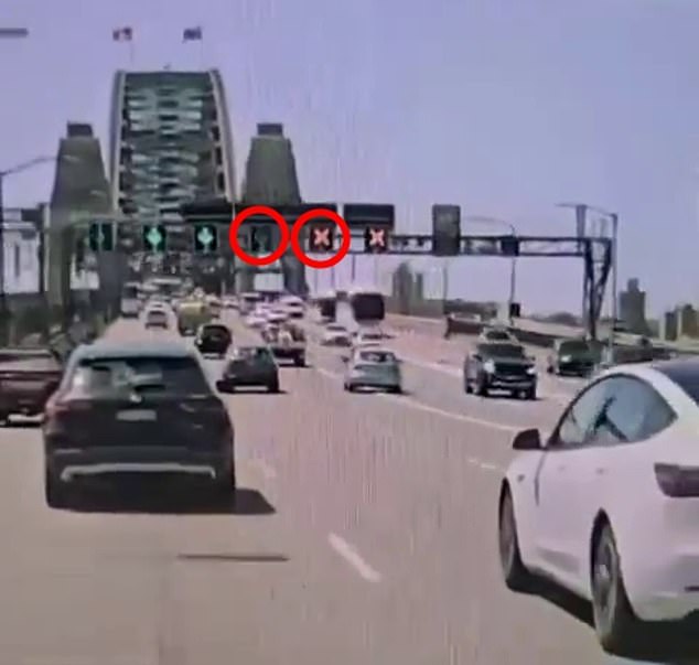 Red crosses and green check marks (circled in red) indicate which lanes are available for motorists traveling north and south on the Sydney Harbor Bridge