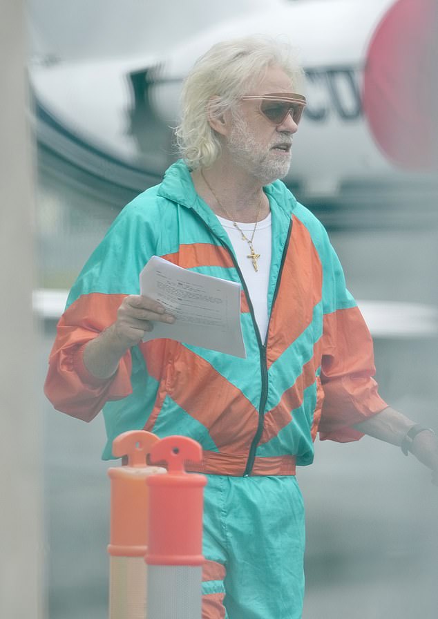 The world-famous hitmaker was spotted on the tarmac during rehearsals for his upcoming film starring Chuck Norris, Vanilla Ice and Sophie Monk