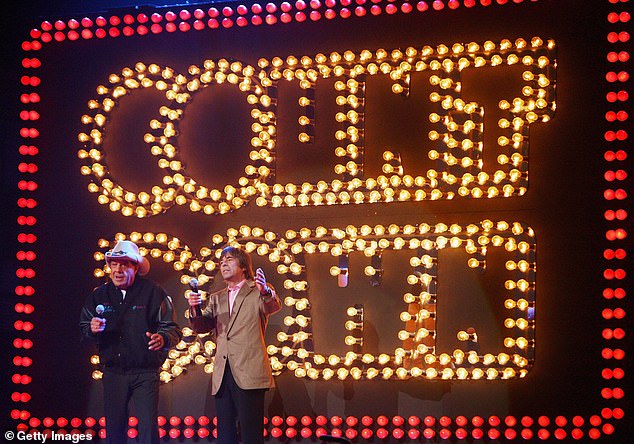 Meldrum and singer John Paul Young appear on stage at the Countdown Spectacular 2 at Sydney's Rod Laver Arena in 2007