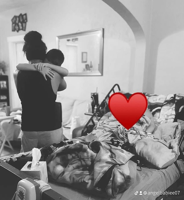 Diarte-Carr's cousin posted a black and white photo of a relative hugging her son as his mother lay dying in bed next to them. She is obscured by a red heart emoji in the image