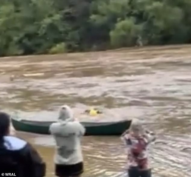 Footage of the daring rescue shows him launching himself from a rowboat into the strong icy currents of the New River