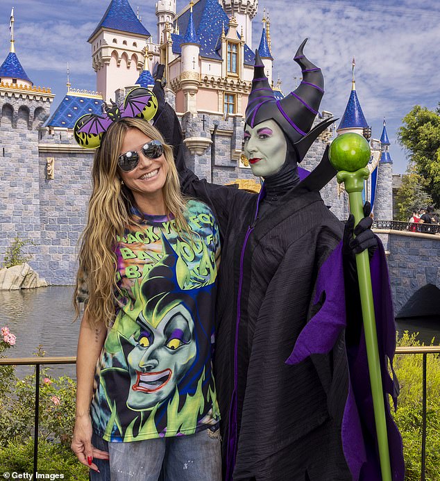 Earlier that day, Heidi wore a pair of spooky Halloween-themed Micky Mouse ears and a bold graphic T-shirt as she posed for photos at the Anaheim resort.