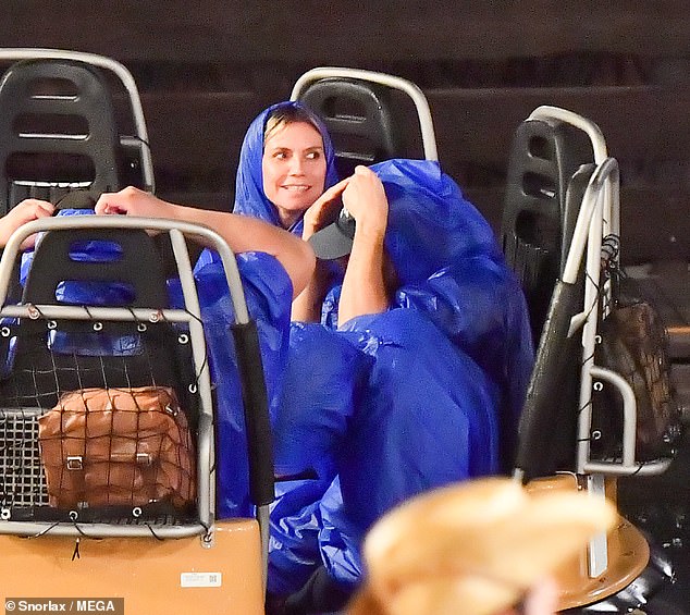 Heidi Klum was unceremoniously drenched while visiting Disneyland Anaheim with husband Tom Kaulitz on Sunday