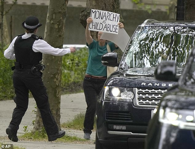 Ahead of Kate's visit last year, a police officer rushed to the protester outside the Foundling Museum