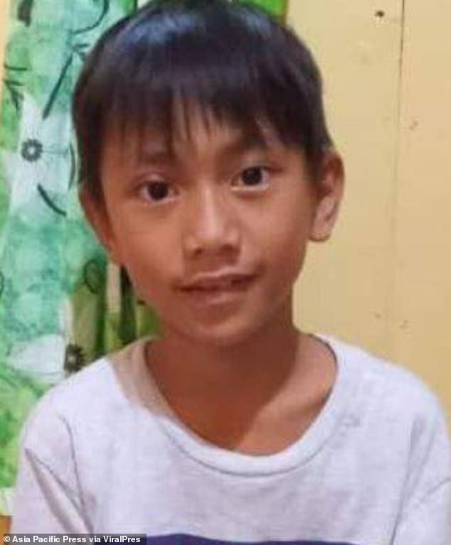 Denis Rodi, 10, was snatched by the large saltwater crocodile while playing with friends in the shallow waters of Sinakut Beach