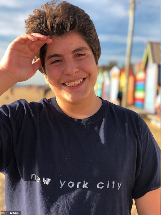 James Tsindos shields his face from the sun at the Brighton Beach Boxes in Victoria. He had a known allergy to certain nuts and died after consuming a small portion of a meal purchased through an online food delivery company