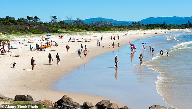 Swimmers can now 'check before they swim' at NSW beaches and inland swimming spots, while the state's new real-time water quality monitoring system is now operational (pictured is Belongil Beach in Byron Bay)