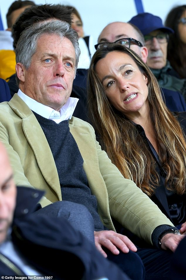 Hugh Grant cut a dapper figure as he watched a football match with his beautiful wife Anna Eberstein at the Giuseppe Sinigaglia Stadium in Como, Italy, on Saturday.