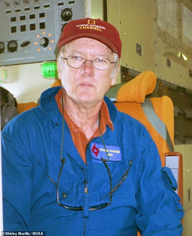 Above, a photo of Peter Dodge taken by Shirley Murillo for the U.S. National Oceanic and Atmospheric Administration (NOAA) during a hurricane research flight in 2005