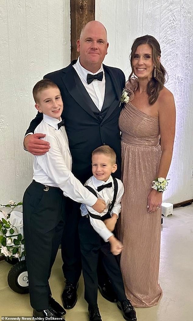 Ashley DeSkeere, 43, suffered from vomiting and breathing difficulties after attending a wedding with her husband and children (pictured here)