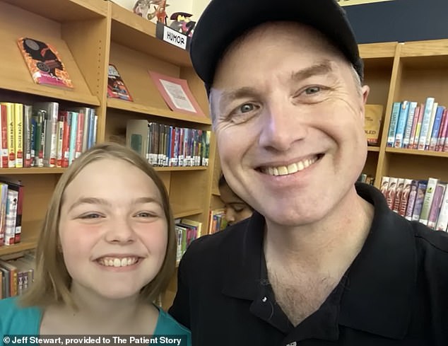 TRAGIC: John, pictured with his youngest daughter, had no symptoms before his cancer diagnosis