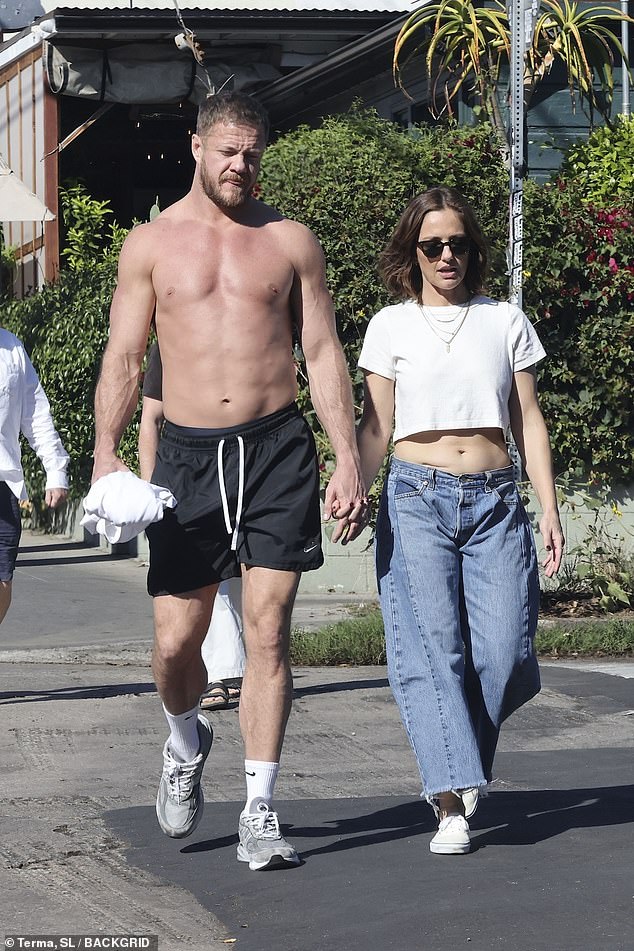 Imagine Dragons frontman Dan Reynolds enjoyed a shirtless stroll with his girlfriend - Blackwater Lane actress Minka Kelly - in Los Angeles on Monday, ahead of his four-night stand at the Hollywood Bowl