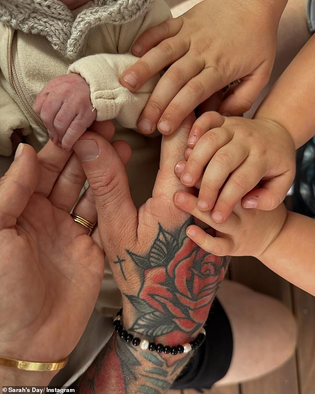 Confirming her son's arrival, she posted her very first photo with her new addition, whose name she has yet to reveal, as she shared a photo of herself cradling her baby boy's hand.