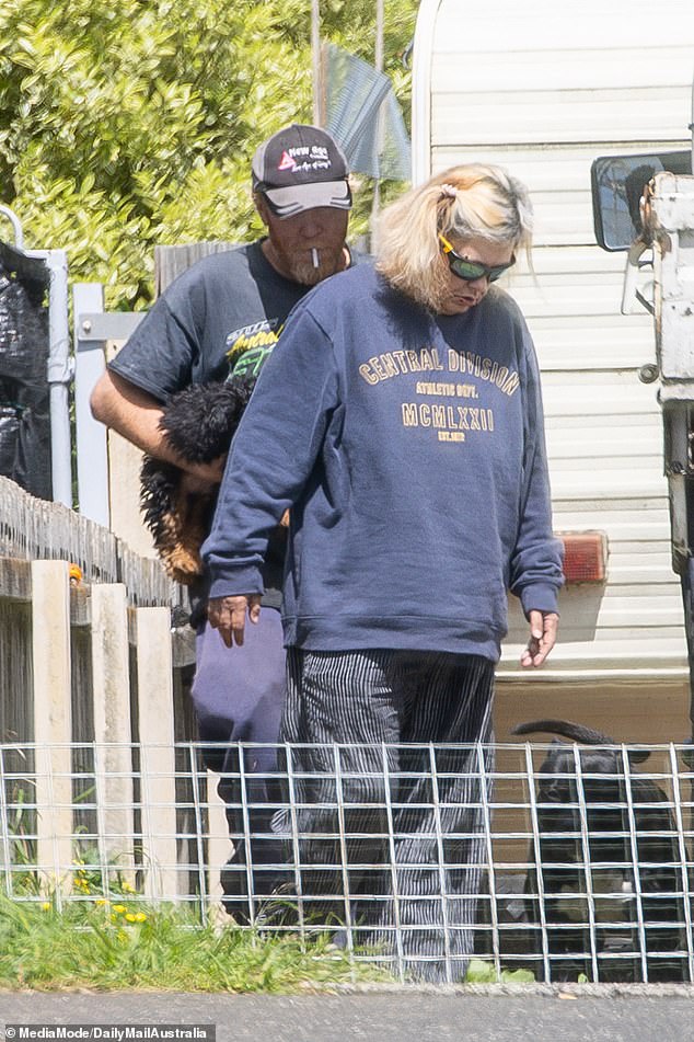 Pictured: Jamie McCulloch and Jacinta King outside the camper they share in Devonport