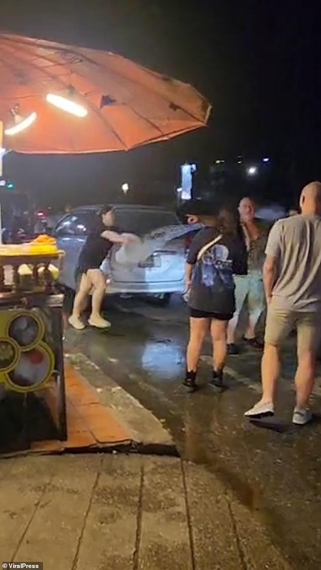 Insisting it was a safety hazard due to the nearby petrol tank, dessert stall staff decided to take the matter into their own hands, throwing bowls of cold water on the burly man.