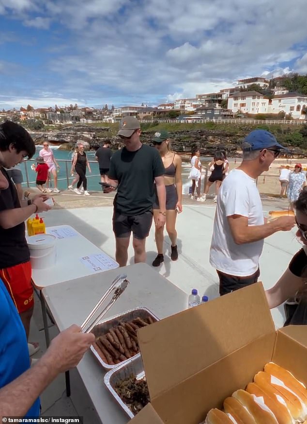 Dozens of social media users branded the price of the sausage rolls as a joke (pictured people were served sausage rolls at Sydney's Tamarama Surf Live Saving Club)